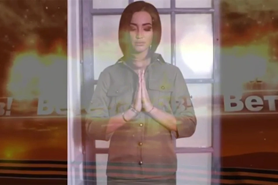 В начале видео появляется скорбный образ звезды со сложенными в молитве руками