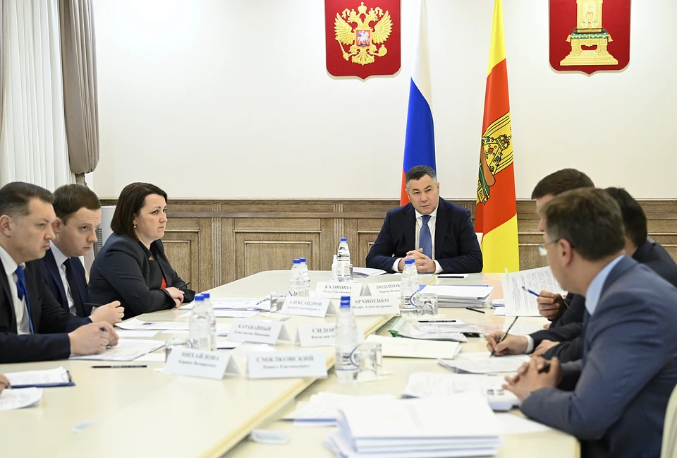 На совещании.